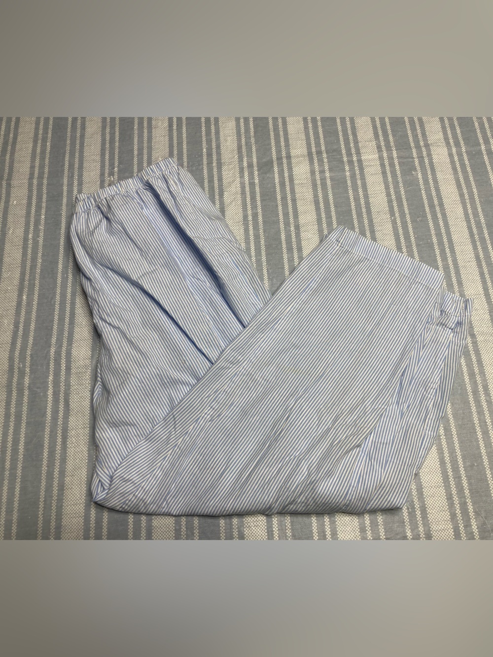 Designer pinstriped pajama bottoms.